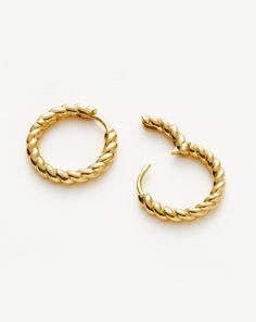 Twisted Helical Small Hoop Earrings | 18ct Gold Plated Vermeil. Introducing Our Lightest Ever Hoops — an Elevated Collection of Everyday Essentials that are Anything but Basic. Our Best Selling Helical Mini Hoops Have Been Upgraded with a Modern Twist. Plus, they Feature a Hidden Hinge for a Seamless Closure. Wear Solo or Style with Studs and Mini Hoops for an Instant Ear Stack. Metal: 18Ct Recycled Gold Plated Vermeil on Sterling Silver Hoop Dimensions: 18mm X 18mm Weight: 4g Product Code: Mh-G Double Chain Bracelet, Malachite Necklace, Small Hoop Earrings, Ear Stack, Pearl Pendant Necklace, Coin Necklace, Recycled Gold, Sterling Silver Hoops, Recycled Sterling Silver