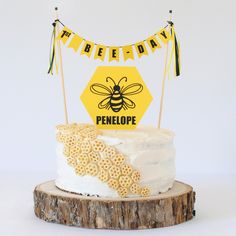 there is a cake that has been decorated with honeybees and flags on it