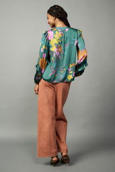 This floral-print blouse offers a welcome punch of color and pattern to the season's ensembles. Detailed with a clean placket and ruffle trim at the shoulders and sleeves, the V-neck top will become an instant favorite. •Split neckline with placket •Long sleeves •Elasticized cuffs •Ruffle trim •Relaxed fit •Relaxed Fit DIMENSIONS •Standard: 24.75" Length Item number 2230399-1100% Polyester Floral Print Blouses, Floral Ruffle, Green Blouse, Print Blouse, V Neck Tops, Ruffle Trim, Printed Blouse, Item Number, Ruffles