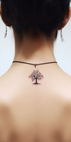 A subtle and lifelike tree tattoo enhances the back, signifying the wearer's dedication to preserving nature. Check out our 'TreeTee' Etsy shop, where each purchased tee contributes to our mission of tree planting, fostering a greener world. Traditional Tree Tattoo, Jasmine Tattoo, Tattoo On Back, Tree Tattoo Designs, Cat Tattoo Designs, Plant Tattoo, Latest Tattoos, Face Tattoos, Plant A Tree