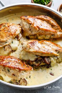 chicken with mushrooms and sauce in a pan