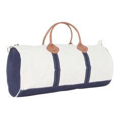 Whether you're commuting from work to your daily trip to the gym or packing light for a weekend getaway, the Round Duffel is your ideal on-the-go Duffel bag. This natural canvas body bag is paired with navy trim, including matching solid dyed round ends. It features a top zip closure, two inner pockets, a detachable shoulder strap and soft genuine leather handles for comfortable carrying. If you're looking for a classic, stylish travel trio, the Round Duffel pairs beautifully with the Flight Bag Packing Light, Body Bag, Duffel Bag, Leather Handle, Antique Brass, Shoulder Strap, Genuine Leather, Navy, Monogram