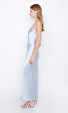 A bestselling silhouette, the Moon Dance Strapless Dress is an easy-to-wear bias-cut design that flatters all body shapes. The maxi dress features a statement low cowl back fastened with a back clip and finished with a rolled hem. Moon Dance, Dress Dusty, Satin Maxi Dress, Rolled Hem, Fitted Skirt, Cut Design, Elegant Dress, Dusty Blue, Satin Dresses