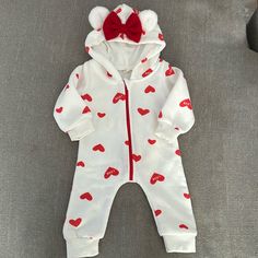 Never Worn. Great Condition. Hood Has Fuzzy Bear Ears And Red Bow. Has Red Zipper And Read Hearts All Over. Size 70 Which Is 9-12 Mos Red Playful Winter Onesie, Playful Red Winter Onesie, White Cotton Winter Onesie, Cute White Onesie For Winter, Cute Hooded Onesie For Playtime, Red Winter Onesie For Playtime, Red Onesie For Playtime In Winter, Cute White Winter Onesie, Red Long Sleeve Onesie For Playwear