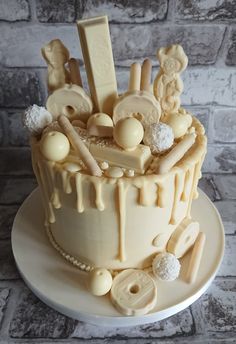 a cake decorated with fondant and candies on a plate