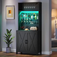 an illuminated bar cabinet in the corner of a room with a potted plant next to it