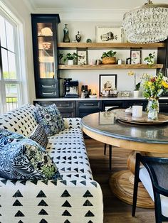 a living room filled with furniture and a table