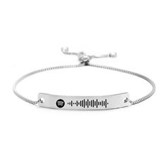 a silver bracelet with a measuring tape on the front and an inscription that reads, i love