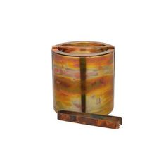 an orange and brown glass candle holder on a wooden stand with a black strip at the bottom