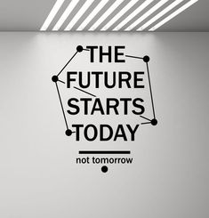 the future starts today not tomorrow wall sticker in an office with white walls and black lettering