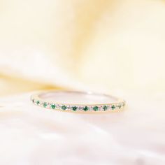 "Materials Gold, Rose gold, White gold Emerald and Diamond Eternity Band / 14k Yellow Gold Micro Pave Diamond and Emerald Eternity Wedding Ring / Engagement Ring / Solid Gold Ring Item Features Features * Made to Order * Material: 14K Solid Gold (If 18K is needed, please inquire) * Gold Color Choice: Rose Gold, Yellow Gold, White Gold * Gemstone Cut: Round * Gemstone: White Diamonds and Emerald * Diamond Color: k Color * Diamond Clarity: SI (TRUE SI) * Setting Type: U Setting Micro Pave * Number K Color Diamond, Eternity Wedding Ring, Stackable Diamond Rings, Diamond Eternity Band, Solid Gold Ring, Natural Diamond Ring, Etsy Gold Ring, Solid Gold Rings, Eternity Band Diamond