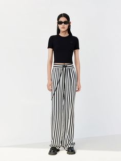 MO&Co. Women's Drawstring Striped Straight Pants Features : - Double side pocket design- Striped, wide leg with a straight fit- Elasticized waistband with a drawstring Code: MBC1PATT10The back length of size M is 107cmMATERIALS & CARE Material: 100% ViscoseNot water wash, do not bleachHang to dry in the shade, do not tumble dryLow temperature ironing pad, professional dry cleanPlease select your own size in the size chart according to your figure and serve model size as a guideline.REMINDER: All