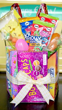 an easter basket with candy and candies in it