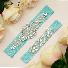 Aqua blue wedding garter set includes both the keepsake garter and toss garter.                                                                                The beautiful and delicate keepsake garter is handmade with 1.5" stretch lace and faux pearl and rhinestone applique measuring 6" wide and 2"high.  The toss garter is made with 1" stretch lace and a rhinestone applique measuring 4" wide and 1"high. Fashion tape is included to keep your garter in place. The garter set comes wrapped in a gif Blue Garter Wedding, Bridal Garter Blue, Aqua Blue Wedding, Rhinestone Garter, Wedding Garter Blue, Lace Garter Set, Garter Wedding, Wedding Garter Lace, Blue Garter