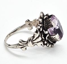 Astro Hungarian Arts and Crafts 2.66ct amethyst antique sterling silver ring. Good vintage condition with little signs of normal vintage wear. Great vintage patina. Unique wide handcrafted prongs hold a 2.66 ct amethyst. Stamped Hungary 800 on the top surface of the ring band. Acid tests positive for sterling silver. Gemstone tested with Presidium II gemstone tester. Ring measures size 8. Vintage Amethyst Sterling Silver Ring, Antique Amethyst Ring Stamped 925 For Anniversary, Vintage Silver Amethyst Ring For Anniversary, Silver Victorian Amethyst Oval Ring, Silver Victorian Oval Amethyst Ring, Victorian Amethyst Ring With Prong Setting, Vintage Silver Amethyst Ring With Center Stone, Victorian Silver Amethyst Ring, Victorian Sterling Silver Hallmarked Amethyst Ring