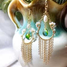 Perfect to style when want go out and add a statement to your look. with these lovely handcrafted earrings, very light and comfortable to wear ❤️M A T E R I A L : - Freshwater pearl - Japanese beads - Royal green blue Czech glass teardrops - S925 gold filled hook - 14K Gold filled cershain ❤️ A B O U T Me All pieces are designed and made by me in Australia. I am in love with the wild botanical, Therefore i want to bring inspiration to everyone that loves nature. ❤️ P A C K A G I N G - All items Dangle Tassel Earrings With Pearl Drop For Gifts, Elegant Tassel Teardrop Earrings, Elegant Teardrop Tassel Earrings, Elegant Handmade Long Drop Tassel Earrings, Elegant Long Drop Handmade Tassel Earrings, White Bohemian Teardrop Earrings For Pierced Ears, White Bohemian Teardrop Earrings, Bohemian Beaded Drop Earrings With Pearl, White Bohemian Jewelry With Dangling Charms