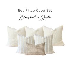 four pillows with white and beige stripes on them, one has a pillow cover set