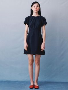 This product is a signature cut-out mini dress with a sleek and modern design. The dress features a subtle cut-out detail that provides a hint of edge to the otherwise simple silhouette. With short sleeves and a flattering shape, it's a versatile piece that can be dressed up with heels or kept casual with flats. - The mini dress's unique cut-out detail adds a contemporary twist to the minimalist style.- Short sleeves and a comfortable fit make it suitable for a range of occasions, from day to night.- Its simple yet elegant cut ensures a versatile piece that's easy to accessorize.- Crafted with a lightweight fabric, the dress promises ease of movement and an airy feel. Chic Black Mini Dress With Cut-out Waist, Unique Dresses, Mini Black Dress, Minimalist Fashion, Cut Out, Sleek, Comfort Fit, Modern Design, Twist