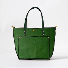 The Leaf Cypress Travel Tote is a handmade, full-grain leather tote bag. Leaf Cypress is a thick and soft leather, with a pillowy texture, even color with little to no pull-up, pebbled grain, and a vibrant green color. The Leaf Cypress Travel Tote comes standard with Green handles. Handmade Leather Tote Bag, Classic Leather Tote, Handmade Leather Tote, Leather Tote Bags, Leather Totes, Market Tote, D Rings, Tote Bag Leather, Travel Tote