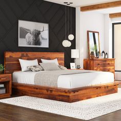 a bedroom with black walls and wooden furniture