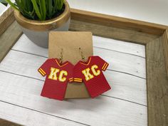 These Chiefs leather earrings are perfect for game day! Show your love and support for the K.C. Chiefs by wearing game day earrings sporting the Chiefs football colors red and yellow! There are dozens of design options of these Chiefs earrings. Choose 18K gold plated, silver plated, or antique bronze hooks. Antique bronze hooks will be made with an extra jump ring. All hooks are nickel free. If you would like the earrings with clip earrings (for un-pierced ears) send me a note. I can make just a Sporty Red Jewelry For Game Day, Kansas City Chiefs Earrings Diy, Kc Chiefs Beaded Earrings, Diy Football Earrings, Kc Chiefs Earrings, Chiefs Earrings, Mike Craft, Chiefs Faux Leather Earrings, Chiefs Leather Earrings