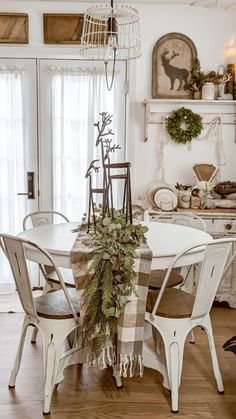 a dining room table with christmas decorations on it