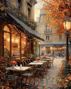 a painting of an outdoor cafe with tables and chairs in the fall leaves, next to a lamp post