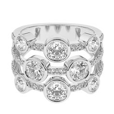 a white gold ring with three stones and diamonds on the sides, set in 18k white gold