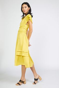 Our most popular dress is back in this classic marigold color. Allover pleating, fluttery cap sleeves, and sweet ruffle accents deliver a decidedly feminine look to this V-neck midi dress. Relaxed fit, size down for slimmer fit •Irregular pleating •V-neck •Cap sleeves •Allover pleating •Ruffle trim •Midi length DIMENSIONS •Standard: 47.5" Length Item number: 1790162 100% Polyester Hand Wash Cold Yellow Knee-length Dress With Ruffle Hem, Yellow Ruffle Dress With Ruffle Hem For Spring, Yellow Pleated Short Sleeve Dress, Yellow Pleated Sleeveless Midi Dress, Yellow Maxi Dress With Ruffles And Short Sleeves, Yellow Short Sleeve Maxi Dress With Ruffles, Spring Yellow Pleated Midi Dress, Yellow Pleated Midi Dress For Spring, Spring Midi Length Pleated Ruffle Dress