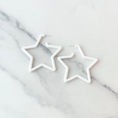 White Star Earrings White Star Earrings, Formal White Star-shaped Jewelry, White Star-shaped Earrings For Wedding, White Star-shaped Earrings As Gift, Cheap White Star-shaped Earrings, White Star-shaped Metal Jewelry, 14k Gold Star-shaped White Gold Earrings, White Star-shaped Earrings With Star Charm, Bridal Jewellry