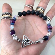 Genuine Herkimer Diamonds & Celtic Knot Bead Bracelet /Silver Plated Celtic Charm & Spacers / Natural Healing Stones / Fits 6 To 7.5 Inch Wrist ( If You Need Different Size Lmk) Handmade By Me 2 Genuine Herkimer Diamonds On Each Side ! Genuine 8mm Purple Tiger Eye Bead Gems . 8mm Black Lava Rock & Rainbow Reflects Sea Glass .Oil Diffuser , Nordic , Irish , Viking , Pegan ,Witch , Fairy , Semi Precious , Bohochic , Bohemian , Xmas , Gift , Triquetra Glass Oil Diffuser, Witch Bracelet, Silver Bar Bracelet, Witch Fairy, Celtic Knot Bracelet, Purple Tiger, Hand Chain Jewelry, Valentines Bracelets, Elephant Bracelet