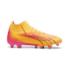 a yellow and pink soccer shoe on a white background