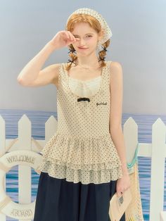 Embrace your sweet and playful side with our charming polka dot sleeveless top. Adorned with a delightful tiered hem and a dainty bowknot, this creamy beige top is a versatile piece that can be paired with various bottoms for a cute and elegant look.  This product just includes one sleeveless top. Garment Size SizeSMLXLFull Length65666768Shoulders32333435Bust889296100 Sleeveless Polka Dot Top For Beach, Cute Polka Dot Sleeveless Top, Sleeveless Polka Dot Summer Tops, Sleeveless Polka Dot Top For Summer, Polka Dot Sleeveless Tank Top, Steampunk Fashion Female, Steampunk Fashion Male, Gothic Skirts, Beige Top