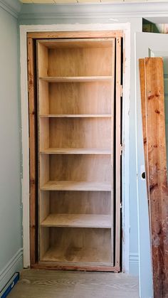 an empty bookcase in the corner of a room that is being remodeled with paint