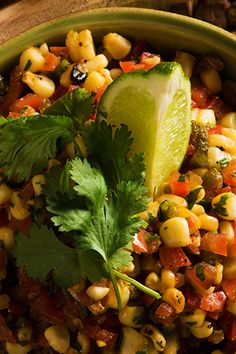 corn salad with cilantro and lime in a bowl