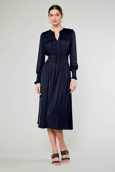 This long-sleeve V-neck midi dress is a vision of sophistication and femininity. The tie-up neckline and ruffle trim add to the allure, and the smocked peplum creates definition at the waist. This one will become a fast favorite. On Average customers say it runs true to size to slightly small •V-neck with tie detail •Ruffle trim •Elasticized waist •Long sleeves •Mid-length hem DIMENSIONS •Standard: 49" Length Item number 2590036CA100% Polyester Gentle cycle cold Dry line Chic V-neck Midi Dress With Smocked Cuffs, Workwear Midi Dress With Smocked Bodice, Elegant V-neck Smocked Dress For Brunch, Elegant V-neck Smocked Dress With Smocked Cuffs, Long Sleeve Midi Dress With Gathered Waist For Daywear, Long-sleeved Dress With Smocked Cuffs For Work, Elegant Midi Dress For Work With Smocked Cuffs, Elegant Dresses With Smocked Cuffs For Brunch, Midi Dress With Smocked Cuffs For Office