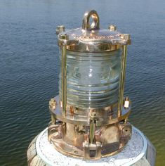 an old fashioned light sitting on top of a pier