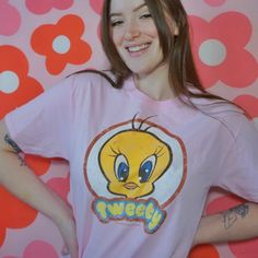 Looney Tunes Retro Tweety T-Shirt This stylish, officially licensed Looney Tunes Retro Tweety T-shirt will be sure to be a hit with any fan. Made from 100% cotton, the t-shirt boasts a classic vintage look that will last through many wears and washes. Show off your love of Tweety with this t-shirt that celebrates the retro look and feel of the beloved character. Officially Licensed 100% Cotton High Quality Pre Shrunk Short Sleeves Color: Pink Printed in the U.S.A. with eco-friendly inks Machine Pop Culture Fan Merchandise T-shirt With Crew Neck, Pop Culture Pre-shrunk Crew Neck T-shirt, Retro T-shirt With Front Print For Fans, Pop Culture T-shirt For Fan Conventions, Pop Culture T-shirt With Screen Print For Fans, Pop Culture Fan Merchandise T-shirt With Screen Print, Short Sleeve T-shirt With Cartoon Print For Fans, Pop Culture Cotton T-shirt For Fan Conventions, Retro Fan Merchandise T-shirt With Front Print