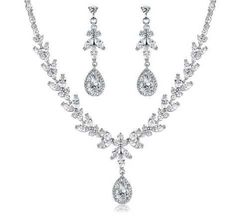 Clear CZ Wedding Jewelry Set Complete your elegant bridal look with our sparkling CZ necklace and drop earring set. This silver plated jewelry set is adorned with brilliant CZ crystals that will add dazzling sparkle to any wedding or special occasion ensemble. Size: The necklace is about 16" long and the pierced earrings are 1.85" long. Color: Silver/Clear. Style: ne1020. This jewelry set would also be fabulous for the mother of the bride or groom or for your quinceanera or prom! This style is a Quinceanera Tiaras, Formal Jewelry, Wedding Jewelry Set, Bling Wedding, Vintage Inspired Jewelry, Cz Necklace, Bridal Look, Cz Jewelry, Silver Plated Jewelry