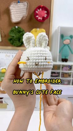 someone is holding up a crocheted bunny's cute face ornament