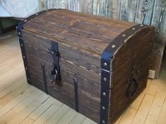 an old trunk is sitting on the floor