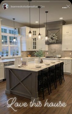 a kitchen with white cabinets and an island in the middle is featured on instagram