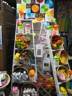 there is a display in the store with many items on it and one shelf full of candy