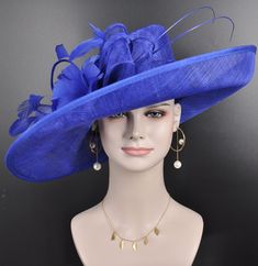 "Description: This beautiful sinamay hat is an elegant wear at any church or derby event. its sinamay material is not too intimidating and attracts the eye. The chic flower adnorment that rests on the wide, side sweep brim is complemented by sinamay accentuations. Material: Sinamay with feathers Crown Width; 8 inch Crown Height: 4 inch Brim Width: 18 inches Head girth is from 22' to 23.22 \" adjustable size fits  most with an adjustable cord strap for the smaller fit If you need to  some colors on the hat to match your dress, please let me know Color on screen may vary from actual merchandise due to monitor restrictions or dye lots." Blue Sinamay Fascinator For Wedding, Elegant Royal Blue Fascinator For Formal Occasions, Elegant Blue Sinamay Fascinator, Blue Sinamay Hat For Party, Sinamay Costume Hats For Royal Ascot Races, Royal Ascot Race Elegant Hat, Elegant Royal Blue Mini Hat For Spring, Summer Event Hats In Sinamay, Elegant Royal Blue Fascinator For Wedding