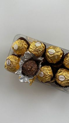 chocolates wrapped in foil and sitting on top of each other