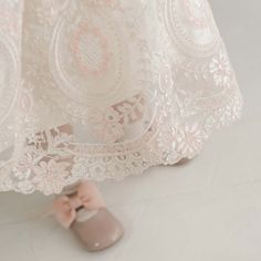 Handmade in the USA A gorgeous Baptism dress for your baby girl, our Elizabeth dress is handcrafted and expertly detailed. It is lined with rich silk Dupioni in an ivory color which enhances the gorgeous embroidered lace that falls over top. The soft pink and ivory embroidered Swiss Dot lace with cording is both comfortable and elegant, and will have everyone believing this is a handmade family dress passed down specially for your little one. Our vintage pink champagne Dupioni silk sash ties all Family Dress, Silk Dupioni, Baptism Dress, Dupioni Silk, Pink Champagne, Swiss Dot, Ivory Color, Embroidered Lace, Vintage Pink