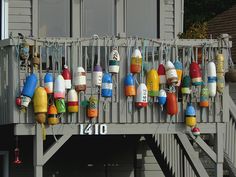 there are many buoys hanging on the wall