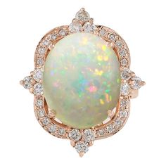 Stamped: 14K Rose Gold Total Ring Weight: 11.2 Grams Total Natural Opal Weight is 10.80 Carat (Measures: 16.00x12.00 mm) Color: Multicolor Total Natural Diamond Weight is 0.80 Carat Color: F-G, Clarity: VS2-SI1 Face Measures: 26.05x21.85 mm Sku: [702214W] Sapphire Cocktail Ring, Opal Diamond Ring, Mom Ring, Gold Luxury, Rose Gold Diamond Ring, Diamond Cocktail Rings, Gold Diamond Ring, La Face, Gold Diamond Rings