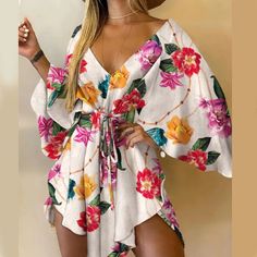 Portrait of a picture displaying Women's Boho Floral V-Neck Mini Dress product. Retro Skirt, Mid Skirt, Chiffon Dresses, Bat Sleeve, Irregular Hem, Mini Dress Casual, Sleeve Dresses, Printed Mini Dress, Party Dresses For Women