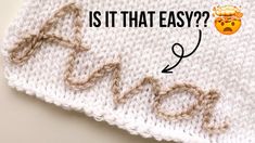 a white knitted blanket with the words is it that easy? written on it